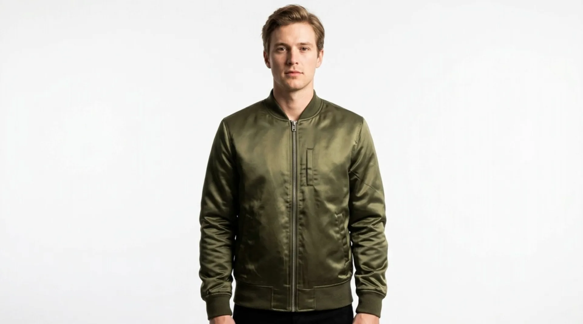 Model wearing an olive bomber jacket before editing